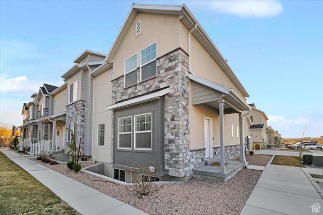 916 N 1190 E, Spanish Fork, UT 84660 - view of home's exterior with a residential view, stone siding, and stucco siding