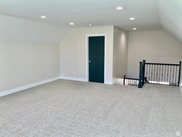 bonus room with lofted ceiling, recessed lighting, carpet, and baseboards
