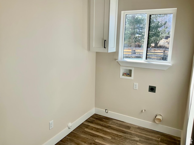 laundry area featuring dark wood finished floors, hookup for a washing machine, gas dryer hookup, electric dryer hookup, and baseboards