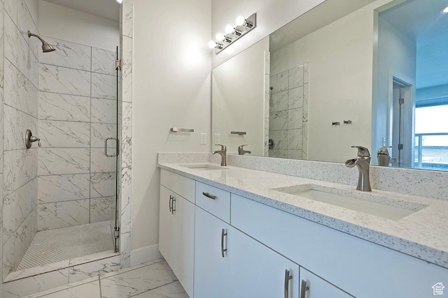 bathroom with marble finish floor, a sink, a shower stall, and double vanity