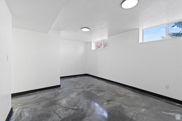 6357 W 3570 S, West Valley City, UT 84128 - interior space featuring a textured ceiling, baseboards, and concrete flooring