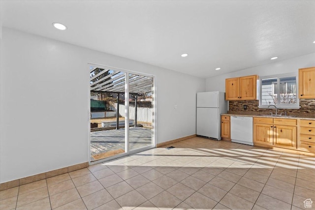 6357 W 3570 S, West Valley City, UT 84128 - kitchen featuring light tile patterned floors, white appliances, light brown cabinets, and decorative backsplash