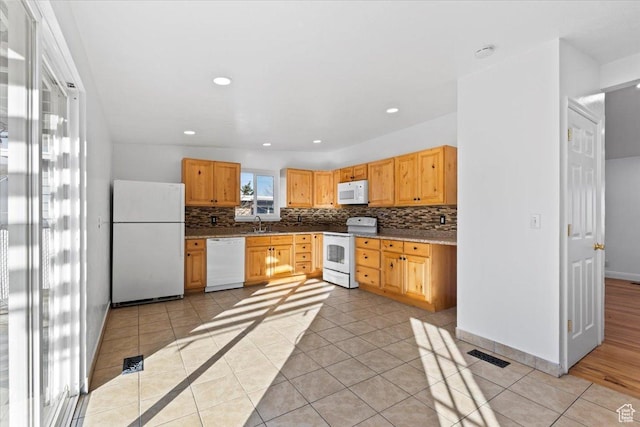 6357 W 3570 S, West Valley City, UT 84128 - kitchen with light tile patterned floors, white appliances, recessed lighting, and tasteful backsplash