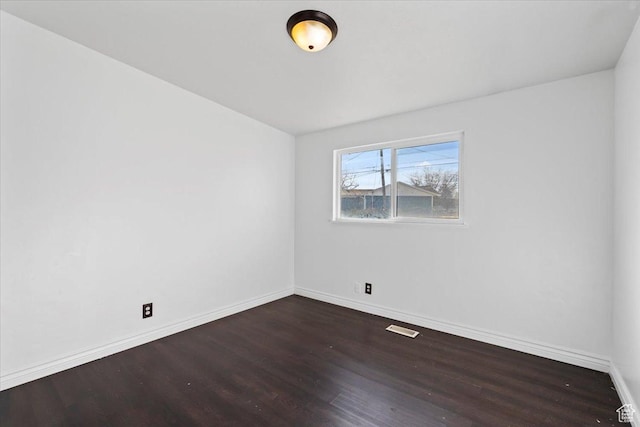 6357 W 3570 S, West Valley City, UT 84128 - empty room with dark wood-style floors, visible vents, and baseboards