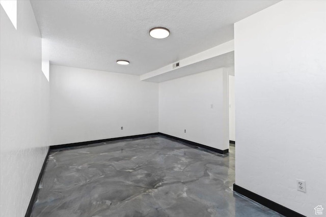 6357 W 3570 S, West Valley City, UT 84128 - spare room with finished concrete floors, visible vents, a textured ceiling, and baseboards
