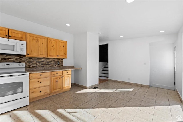 6357 W 3570 S, West Valley City, UT 84128 - kitchen with light tile patterned floors, recessed lighting, white appliances, baseboards, and decorative backsplash