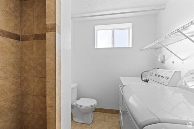 6357 W 3570 S, West Valley City, UT 84128 - full bath with baseboards, independent washer and dryer, toilet, and tile patterned floors