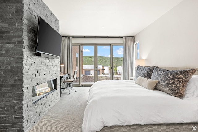 6427 Double Deer Loop, Park City, UT 84098 - carpeted bedroom featuring a stone fireplace and access to exterior