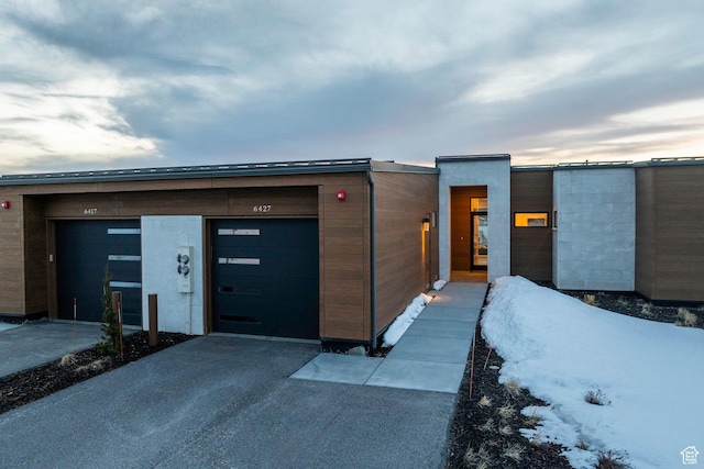 6427 Double Deer Loop, Park City, UT 84098 - contemporary house featuring aphalt driveway and an attached garage
