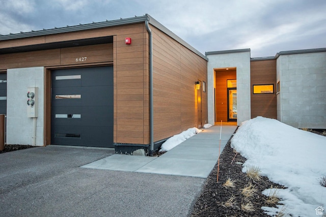 6427 Double Deer Loop, Park City, UT 84098 - exterior space featuring concrete block siding, a garage, and driveway