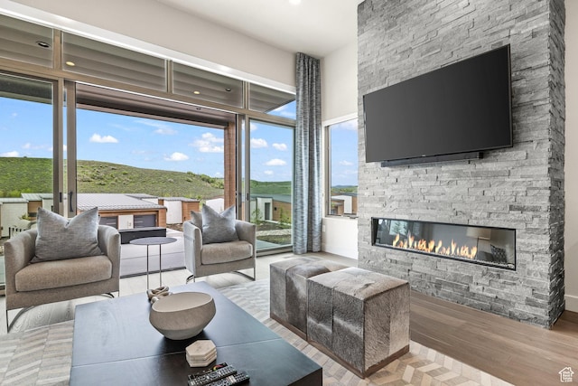 6427 Double Deer Loop, Park City, UT 84098 - living area featuring a stone fireplace and wood finished floors