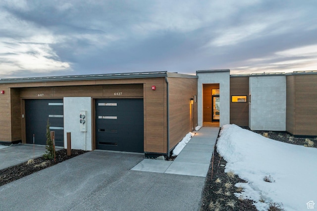 6427 Double Deer Loop, Park City, UT 84098 - contemporary house featuring an attached garage and driveway