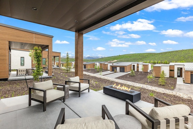 6427 Double Deer Loop, Park City, UT 84098 - view of patio with an outdoor living space with a fire pit, an outdoor structure, and a mountain view