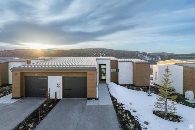 6427 Double Deer Loop, Park City, UT 84098 - contemporary house featuring a standing seam roof, a garage, driveway, and metal roof