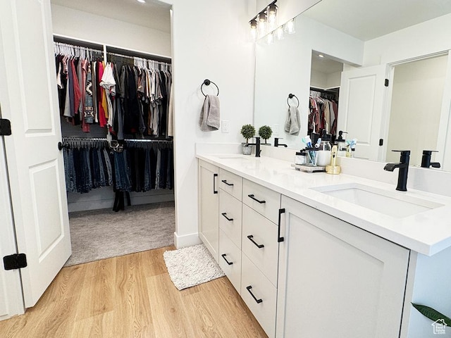 187 W 470 N, Smithfield, UT 84335 - full bath featuring double vanity, a spacious closet, a sink, and wood finished floors