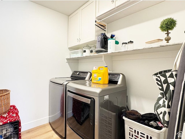 187 W 470 N, Smithfield, UT 84335 - laundry area with separate washer and dryer, light wood-style flooring, cabinet space, and baseboards