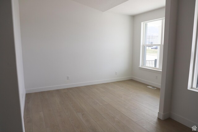 2794 E Liam Ln Unit 101, Eagle Mountain, UT 84005 - unfurnished room featuring light wood-style floors and baseboards