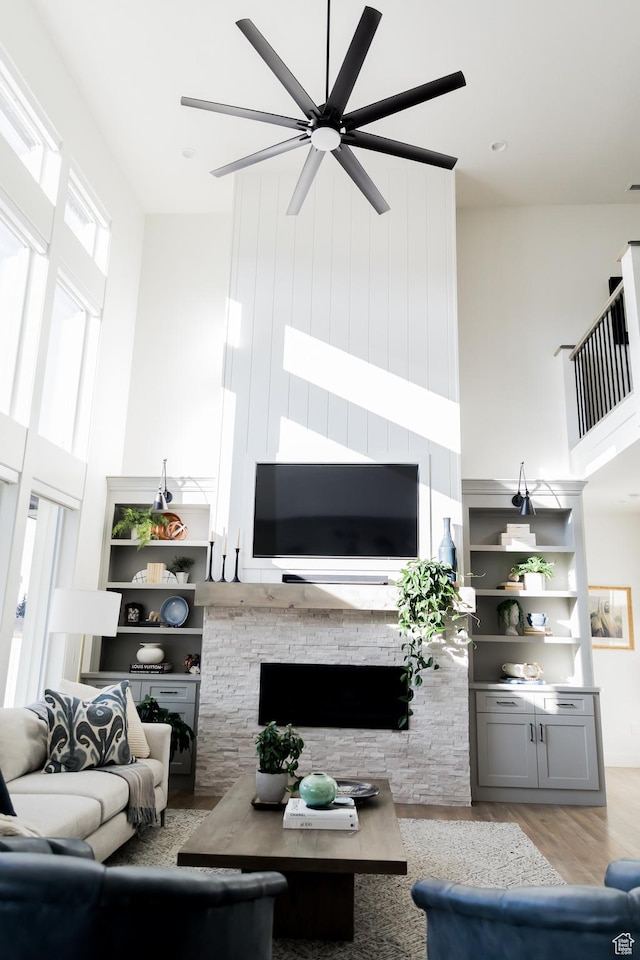 14102 S Sleepy Oaks Ln, Herriman, UT 84096 - living area featuring a high ceiling, ceiling fan, plenty of natural light, and light wood-style flooring