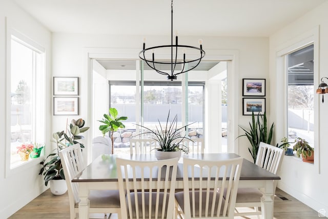 14102 S Sleepy Oaks Ln, Herriman, UT 84096 - dining space featuring a chandelier, light wood-type flooring, and baseboards