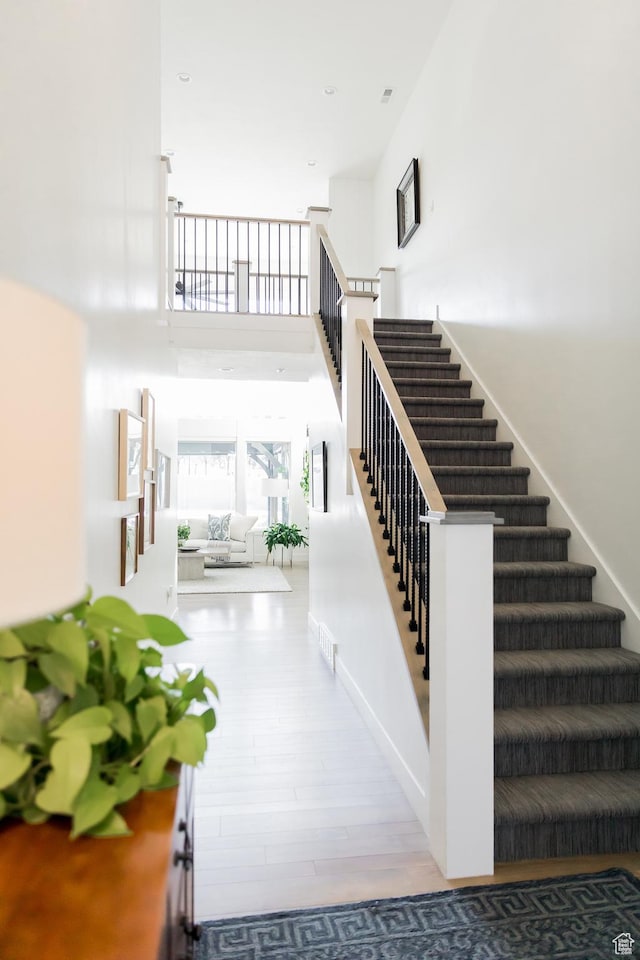 14102 S Sleepy Oaks Ln, Herriman, UT 84096 - stairway with a high ceiling and wood finished floors