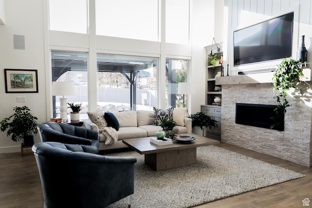14102 S Sleepy Oaks Ln, Herriman, UT 84096 - living room with a high ceiling, wood finished floors, a fireplace, and built in features