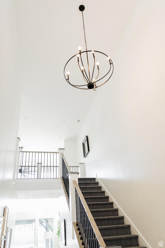 14102 S Sleepy Oaks Ln, Herriman, UT 84096 - stairs featuring a high ceiling and a chandelier