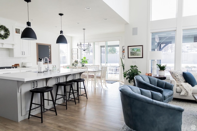 14102 S Sleepy Oaks Ln, Herriman, UT 84096 - living area featuring wood finished floors, recessed lighting, and a chandelier