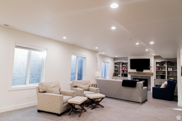 14102 S Sleepy Oaks Ln, Herriman, UT 84096 - living area featuring recessed lighting, plenty of natural light, a brick fireplace, baseboards, and built in shelves