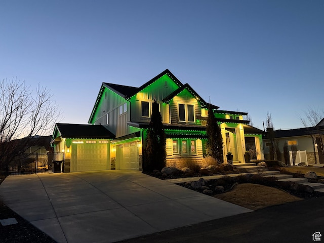 14102 S Sleepy Oaks Ln, Herriman, UT 84096 - view of front facade featuring board and batten siding, driveway, an attached garage, stone siding, and fence
