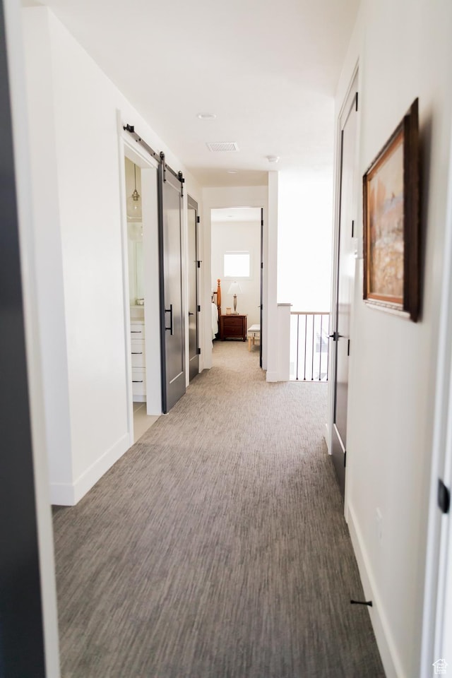 14102 S Sleepy Oaks Ln, Herriman, UT 84096 - hall with a barn door, carpet floors, and baseboards