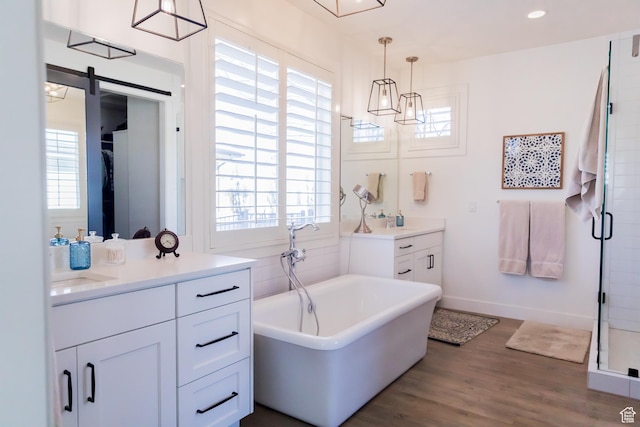 14102 S Sleepy Oaks Ln, Herriman, UT 84096 - full bathroom with plenty of natural light, wood finished floors, a shower stall, and two vanities