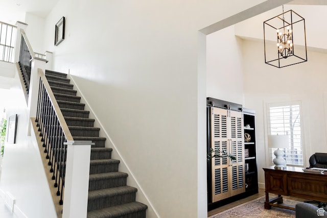14102 S Sleepy Oaks Ln, Herriman, UT 84096 - stairs with a towering ceiling and a chandelier