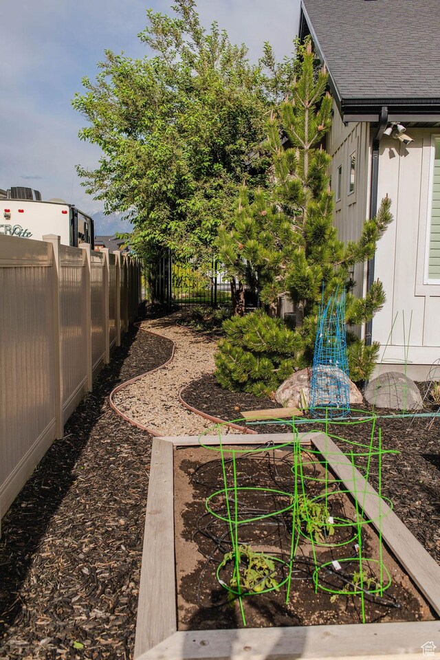 14102 S Sleepy Oaks Ln, Herriman, UT 84096 - view of yard featuring a vegetable garden and fence