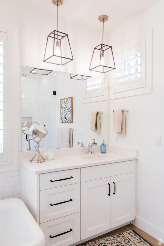 14102 S Sleepy Oaks Ln, Herriman, UT 84096 - bathroom with a soaking tub, vanity, a tile shower, and baseboards