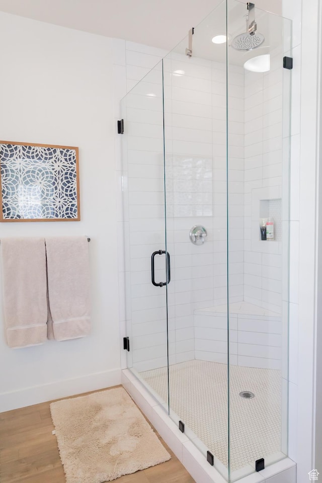 14102 S Sleepy Oaks Ln, Herriman, UT 84096 - full bath featuring a stall shower, wood finished floors, and baseboards