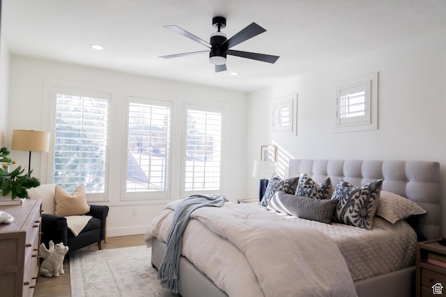 14102 S Sleepy Oaks Ln, Herriman, UT 84096 - bedroom with multiple windows, wood finished floors, baseboards, and recessed lighting