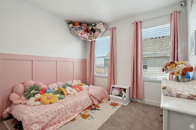 6643 W Skip Rock Rd S, South Jordan, UT 84009 - bedroom featuring a decorative wall, carpet flooring, and wainscoting