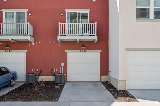 6643 W Skip Rock Rd S, South Jordan, UT 84009 - exterior space with concrete driveway and central AC unit
