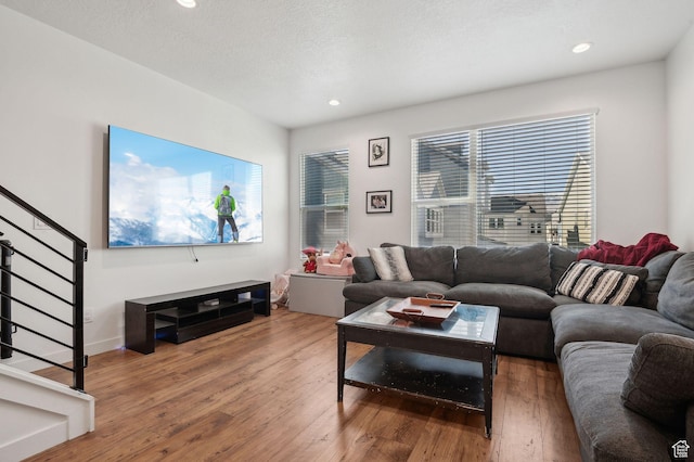 6643 W Skip Rock Rd S, South Jordan, UT 84009 - living room with dark wood-style floors, stairway, and recessed lighting