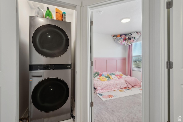 6643 W Skip Rock Rd S, South Jordan, UT 84009 - laundry room with a wainscoted wall, a decorative wall, stacked washer / dryer, carpet flooring, and laundry area