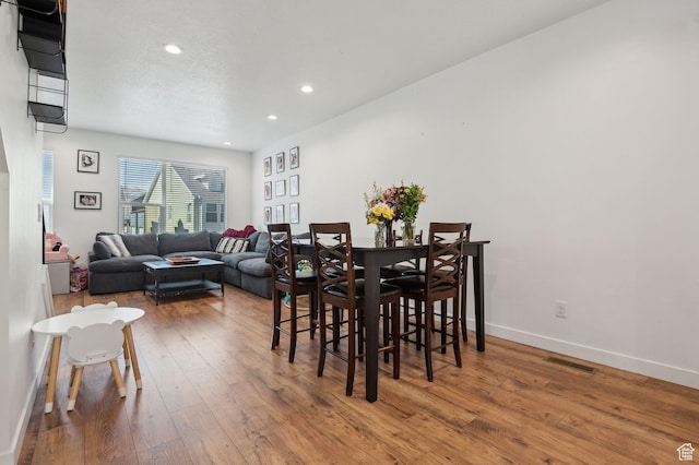 6643 W Skip Rock Rd S, South Jordan, UT 84009 - dining room with recessed lighting, baseboards, visible vents, and hardwood / wood-style floors