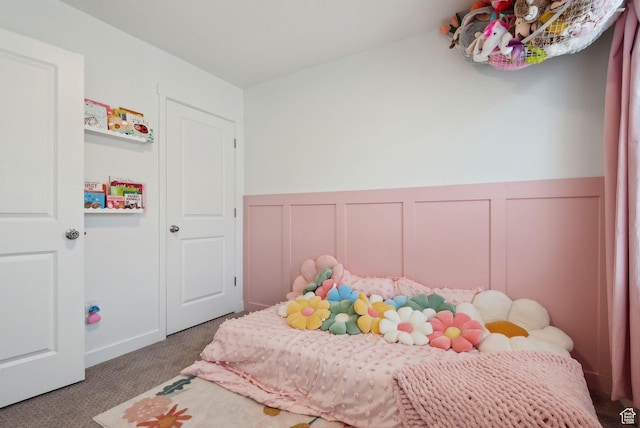 6643 W Skip Rock Rd S, South Jordan, UT 84009 - carpeted bedroom with wainscoting and a decorative wall