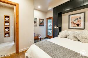 234 Ridge Ave, Park City, UT 84060 - bedroom with dark wood-type flooring, recessed lighting, and baseboards
