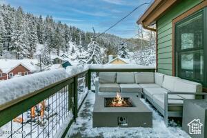 234 Ridge Ave, Park City, UT 84060 - snow covered back of property featuring an outdoor hangout area