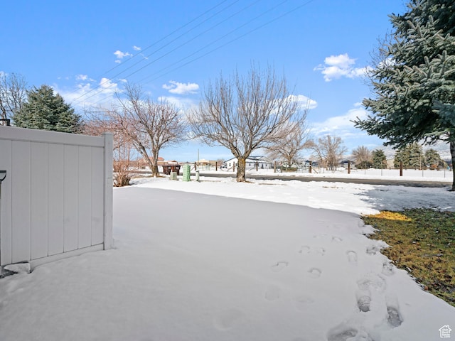 262 W 1975 N Unit 40, Ogden, UT 84414 - yard layered in snow with fence