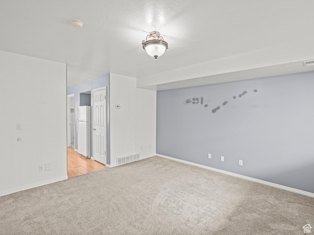 262 W 1975 N Unit 40, Ogden, UT 84414 - unfurnished room featuring visible vents and light carpet