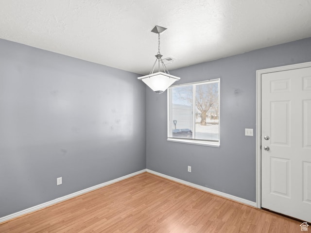 262 W 1975 N Unit 40, Ogden, UT 84414 - spare room with baseboards, a textured ceiling, visible vents, and light wood-style floors