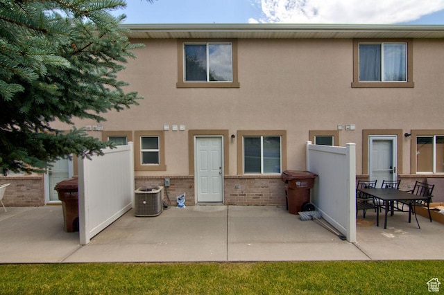 262 W 1975 N Unit 40, Ogden, UT 84414 - rear view of house featuring a patio, brick siding, and stucco siding