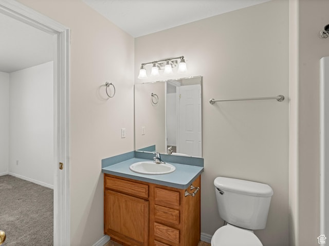 262 W 1975 N Unit 40, Ogden, UT 84414 - bathroom with baseboards, vanity, and toilet