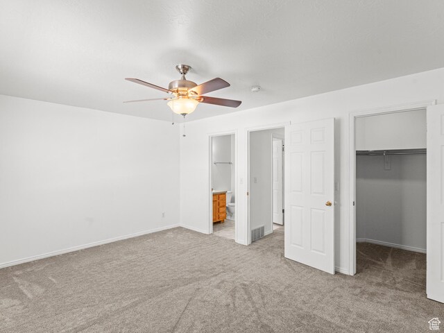 262 W 1975 N Unit 40, Ogden, UT 84414 - unfurnished bedroom featuring light colored carpet, visible vents, baseboards, a spacious closet, and a closet